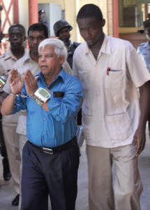 C.N. Sharma being escorted into court yesterday
