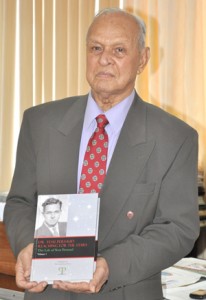 Dr. Yesu Persaud with his book.