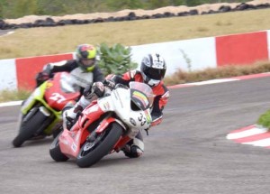 Guyana’s Stephen Vieira (in second) tries to make a move round a turn at the Jamwest Speedway in Jamaica on Sunday.