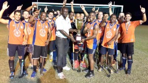  Delyon Josiah of Farfan & Mendes (white shirt) presents the trophy to GCC Captain Devin Hooper in the presence of teammates.