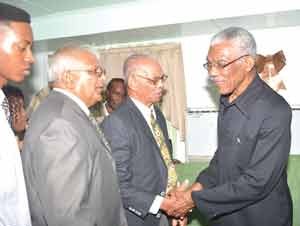 President David Granger is congratulated after his swearing in.