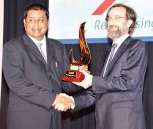 Owner of Nand Persaud and Company, Mohindra Persaud (left), receiving the Green Exporter of the Year Award in Jamaica, recently.