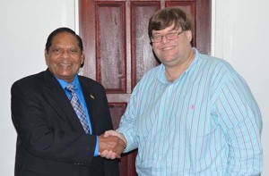 Prime Minister, Moses Nagamootoo, and United States Embassy Charge´ d´ affaires, Bryan Hunt sharing a friendly hand shake after their meeting.
