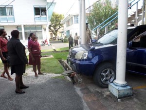Acting Town Clerk, Carol Sooba taking a final glance at M&CC vehicle after handing over the keys