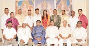 [Back row from left to right): Pt. Krishna Patiram, Pt. Sodama Maraj Pt. Vijay Doobay, Pt. Hardesh Tiwari, Pt. Dhanesh Prashad, Bahinji Devica Uditram, Pt. Gopi Prashad, Pt. Maheshwar Maraj, Pt. Bhagwandin (Dado), and Pt. Aditya Persaud – Front row from Left to Right (sitting): Pt. Ubraj Narine, Pt. Somnauth Sharma, Pt. Rudra Sharma, Pt. Rabindranath Persaud, Pt. Balbadar and Pt. Maneshwar Sawh.