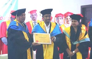 Prime Minister Moses Nagamootoo receives the honour of Excellence in Public Service from the Texila American University. [OPM – Guyana photo)