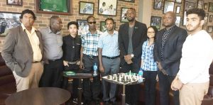 Director of Sports Christopher Jones [4th R), Attorney at Law James Bond (2nd R) pose with the President of the GCF Irshad Mohamed (5th R) and chess players after the ceremony concluded.