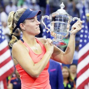 Angelique Kerber, of Germany, holds up the championship trophy after beating Karolina Pliskova, of the Czech Republic, to win the women's singles final of the U.S. Open tennis tournament, Saturday, Sept. 10, 2016, in New York. [AP Photo/Darron Cummings)