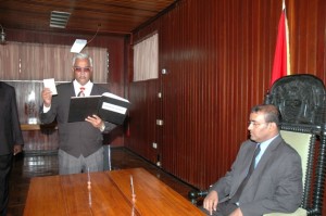 Charles Ramson during his swearing in ceremony as Justice of Appeal taking the oath of office before President Bharrat Jagdeo 