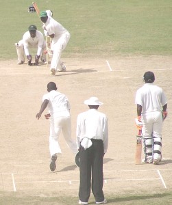 Guyana Wicketkeeper Derwin Christian launches into a big drive off Wavell Hinds during his maiden first-class century against Jamaica yesterday. (Sean Devers photo)