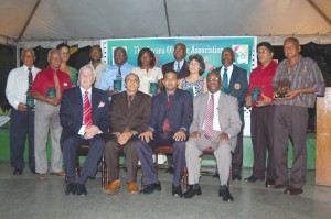  Dr. Frank Anthony (seated 2nd right), David Peterson QC (seated left), K A Juman Yassin  (seated 2nd left) and Ivor O'Brien (seated right) pose with the awardees at Friday's GOA presentation. 