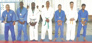 Successful participants in last weekend’s Judo competition display their trophies: From left; Bruce Fraser, Vernon Williams, Verol Williams, Alain Clarke, Imran Mohamed, S. Mohamed and Colin Gomes. 