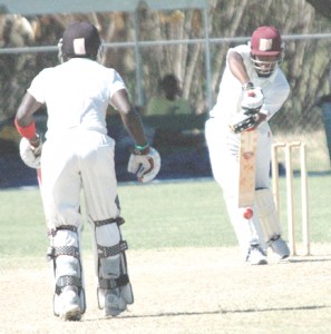 Leon Johnson covers up to Pedro Collins during his elegant second innings 65 as Shemroy Barrington looks for a run.