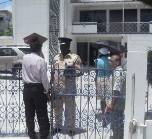 Police performing security duties at CLICO head office, Camp Street.