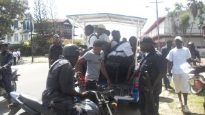 Some of the suspected gang members from the Dolphin  Community High School are taken into police custody.