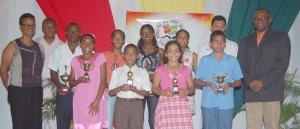 Champions All!!! GASA age group champions for 2008 display their  silverware in the presence of Digicel Marketing Director Donovan White (far right)  and GASA Secretary and President Dr. Karen Pilgrim (far left) and Philip Walcott (2nd left). 