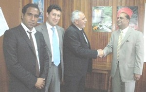Minister Prashad (right) and the Libyan delegation.