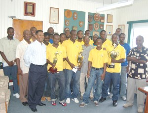  Members of the triumphant Pele pose for a photo with Mayor Hamilton Green (centre with glasses) and organiser Lennox Arthur (right) after the presentation of prizes of the Mayor’s Cup tournament. 