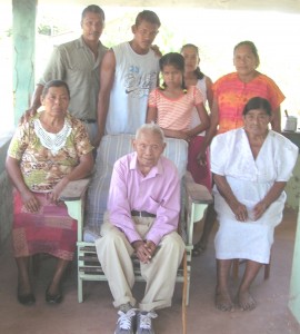 Sonny Hendricks poses for a family portrait. His 90-year-old wife is seated at right.