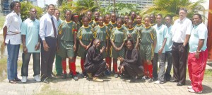 The historic IGG female football team pose with Minister of Sport Dr. Frank Anthony (3rd left)  and Chairman of the NSC Conrad Plummer (2nd right). Captain Tiffany Sancho is to Dr. Anthony's left. 