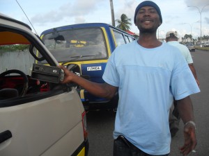 “What’s wrong with a little music?” A minibus driver  protests the removal of his tape deck from his vehicle during  a police crackdown on music in public transportation.  
