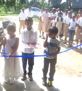  Grandchildren of Dipnarine and Bhagmatie Joree cut the ribbon to open the St Helena College.