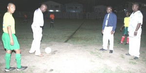 Regional Chairman, Holbert Knights (2nd right) about to kick off the ball signaling the start of the Regatta Football tournament 2K9. Witnessing the moment from right, BFA Secretary and President Carlton Beckles and Carlos Prowell.