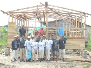Some of the students of the Oakwood University, Alabama, US and from the St. Thomas College, US Virgin Island in front of the house yesterday as they complete the construction work. 