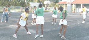 The national Under-16 netballers (in green bib) seen in a friendly match against a Rest Team yesterday at the Cliff Anderson Sport Hall Tarmac.