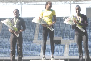 Aliann Pompey (centre) is overjoyed after collecting her gold medal and bouquet at the Rio Grand Prix, Brazil yesterday.