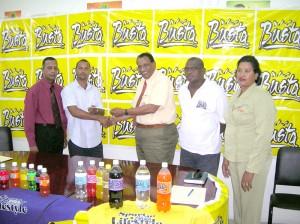 THANK YOU SIR: Seems to be the words of Roland Persaud (2nd left) as he collects the sponsorship check from Selman.  From left is Marketing Consultant, Bish Panday, Edward Skeete and Company Secretary (GBCL), Shamieza Yadram. 