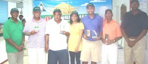 From left: Mel Sankies, Lusignan Golf Club President, Clifford Reis, Dr. Ram Singh, Tonia Griffith, winner Lester Alvis, Jerome Khan and Eton Chester, Citizens Bank Managing Director following the presentation. 