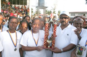 Corriverton Queens pose with the Prakash Singh Memorial trophy