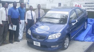 GT&T officials and competition sponsors pose beside the  brand new Toyota VIOS motor car up for grabs in the competition. 