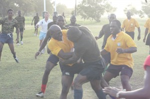 This photo shows the intense contest for possession between the two sides.