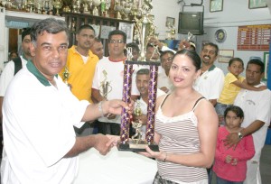 Skipper Mikes Singh receives Winning Trophy from DDL a representative.