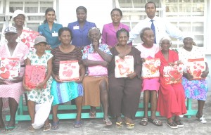 Staff members of the New Amsterdam Branch of the Bank of Nova Scotia and the ladies of the Good Samaritan Home.