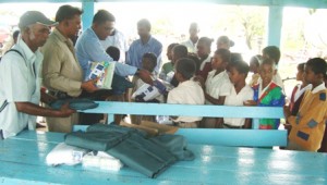 MIBICURI, BLACK BUSH POLDER- The Central Committee members of the People’s Progressive Party distributed educational and hygiene kits to some students of the Mibicuri Primary School at Black Bush Polder. 