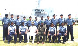 Members of the Coast Guard Young Officers’ Course #1, pose with Commodore Gary Best, Colonel Mark Phillips and their instructors.        