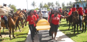 The cowboys form a guard of honour as the body of ‘Shaggy’ Usher is borne out of the church, yesterday.