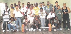 Successful participants at the just concluded weightlifting event display their prizes.