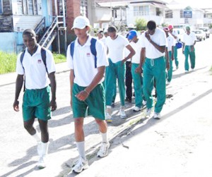 The Guyana team leave their Third Street, Alberttown encampment base for a training session at the National Park Saturday afternoon.