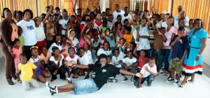 Cellink Jingles and Song Competition semifinalists share a joyous moment with  occupants and teachers of the Egbert Benjamin Exhibition and Conference Centre in Linden