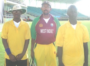 MATCH WINNERS: Denal Shim (left) and Jason Rickettes (right), pose with their manager, Glendon Coke shortly after registering an emphatic victory over Guyana.