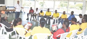 Nazim Hussain, NAPS Community Mobilization Coordinator (centre) emphasizes a point during the Workshop with members Pele F.C. 