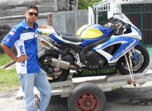  Reigning champion Stephen Vieira poses with his 2008 Suzuki CSZR 600cc motor bike shortly before leaving for a practice session yesterday.