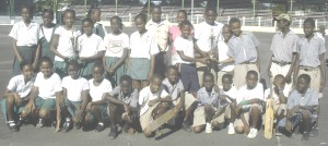 The respective Boys and Girls champions St. Pius (right) and St. Angela’s Primary Schools pose with  their trophies at the presentation ceremony yesterday. 