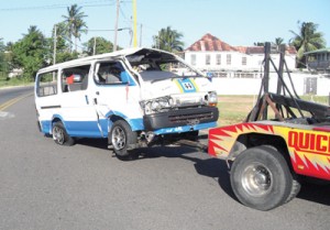 The Minibus from which 15 escaped death, being towed from the scene. 