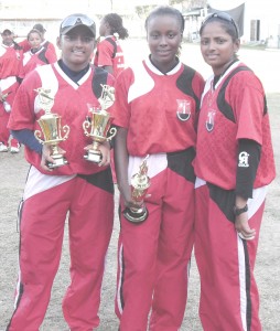 Three is company! Player of the Match Whitney Cudjoe is flanked by the Mohammed Twins Anisa (right) and Alisa after the trio lead T&T to victory against Jamaica in the Regional Women’s cricket final at Bourda yesterday. The sisters took 3 wickets each while Cudjoe made an unbeaten 54.