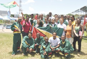 Guyana Goodwill swmimers pose with supporters and team officials at the Aquatic Centre at the end of the 15th Goodwill Championships.